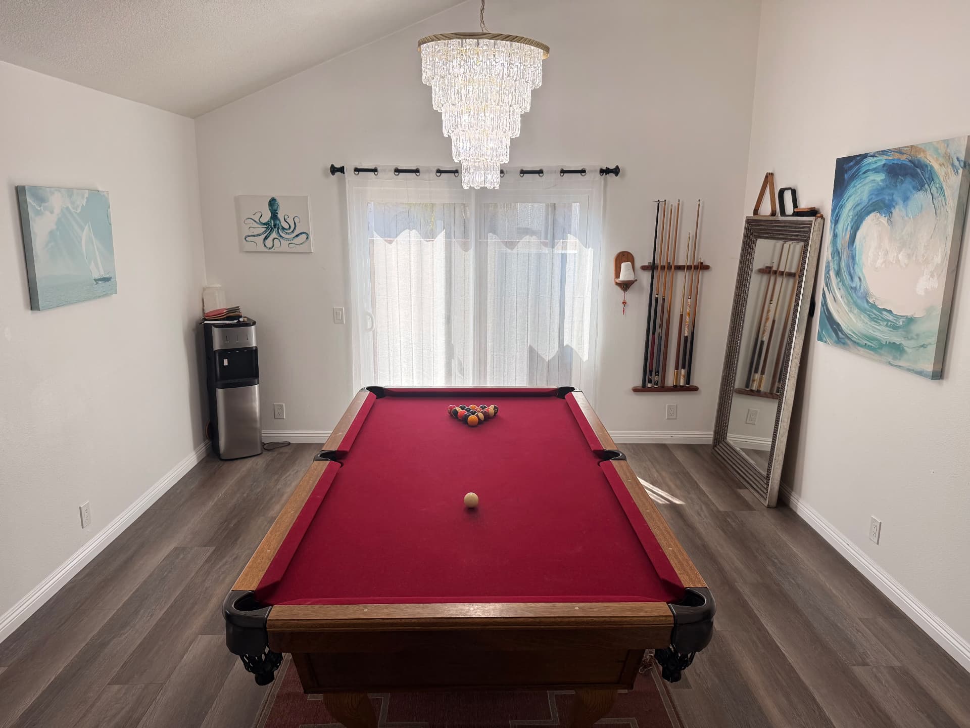 Game room with a pool table and chandelier