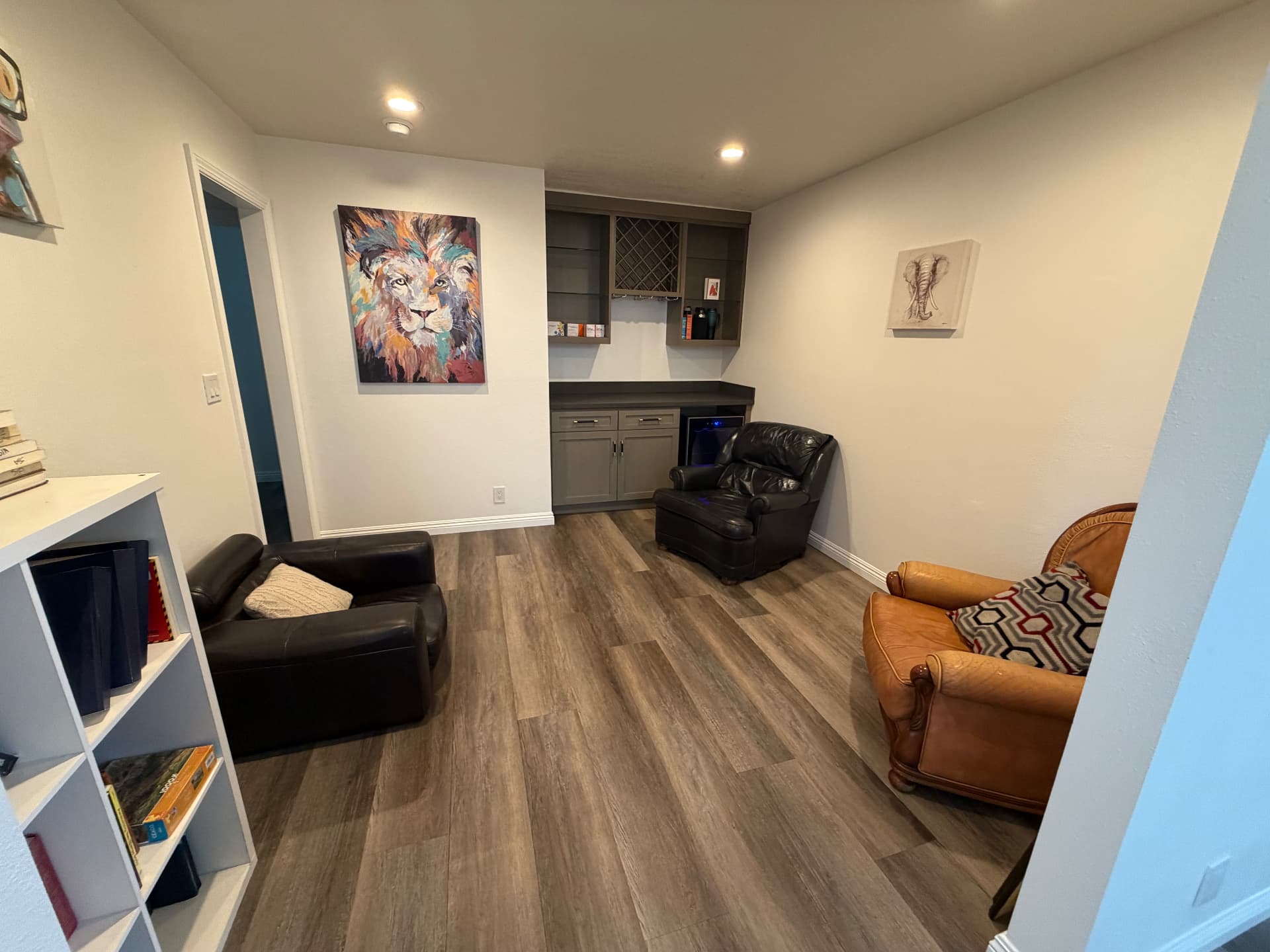 Quiet lounge area with leather chairs and bookshelves